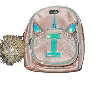 Small Justice pink and iridescent “I” unicorn backpack.